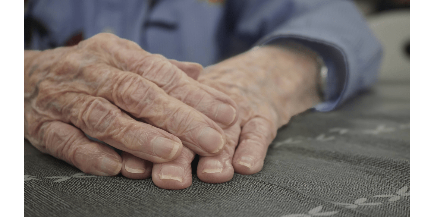 A close-up of Jean Buford’s hands represents her years of experience. 